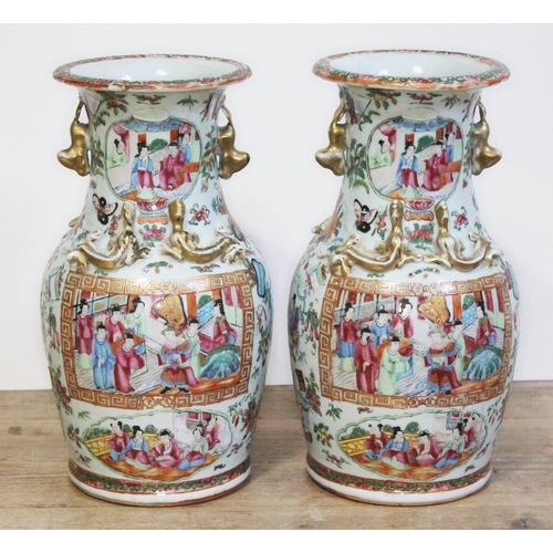 323 - A pair of Chinese Canton famille rose porcelain vases, 19th century, height 34cm.
