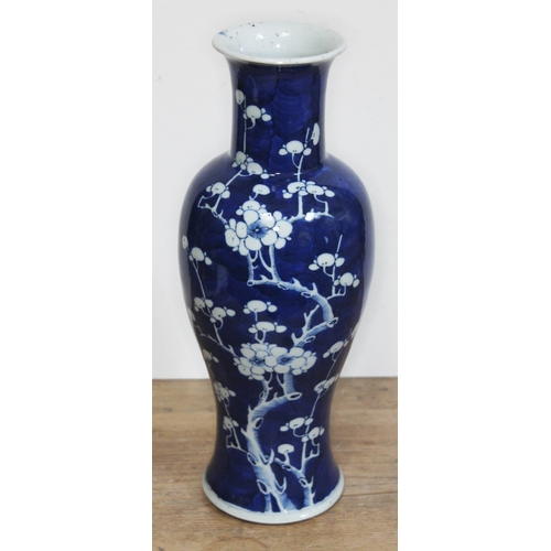 364 - A Chinese blue and white vase decorated with flowering prunus, Kangxi double circle to base, height ... 