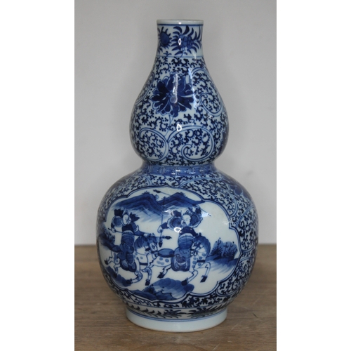 377 - A Chinese blue and white double gourd vase, bearing six character Kangxi mark to base, 20th century,... 