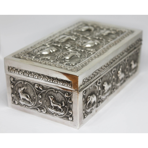 99 - An Indian cigarette box, embossed all over with animals, cedar lined, marked 'K90', length 15.5cm.