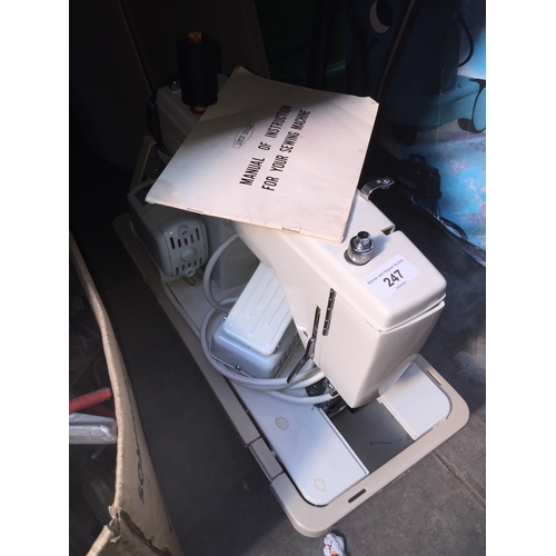 A New Home electric sewing machine complete with pedal, manu... Barnebys