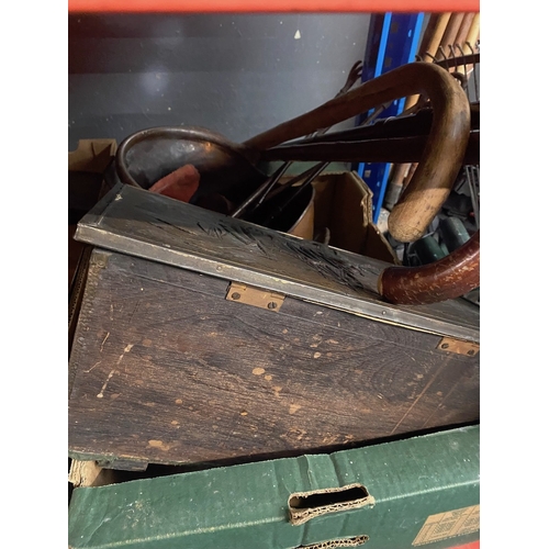 124 - A brass coal scuttle, slipper box, fire tools and 3 walking sticks.