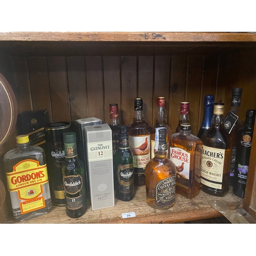26 - A collection of alcoholic beverages to include Teacher's, Glenfiddich, Black Label, Chivas Regal, Hi... 