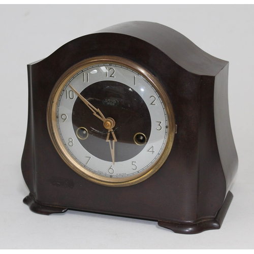 A Smith Enfield bakelite clock with pendulum and key. Barnebys