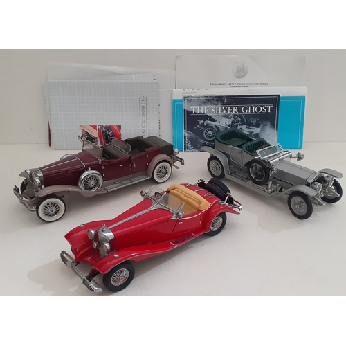 26 - A group of three Franklin Mint die-cast models.