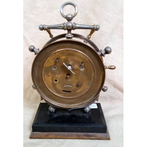 27 - A desk clock modelled as a ship's wheel and anchor.