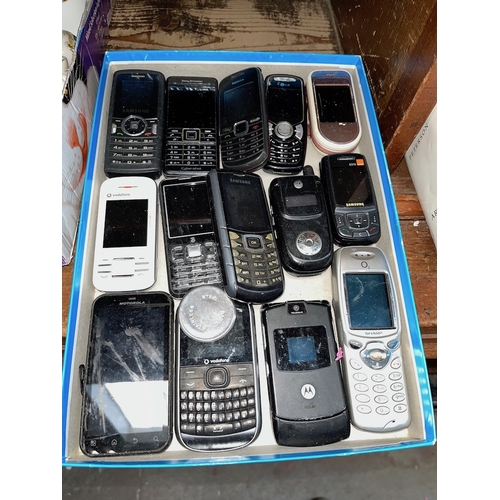 45 - A tray of mobile phones.