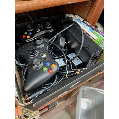 7 - An x Box 360 console, 2 controllers and 3 games
