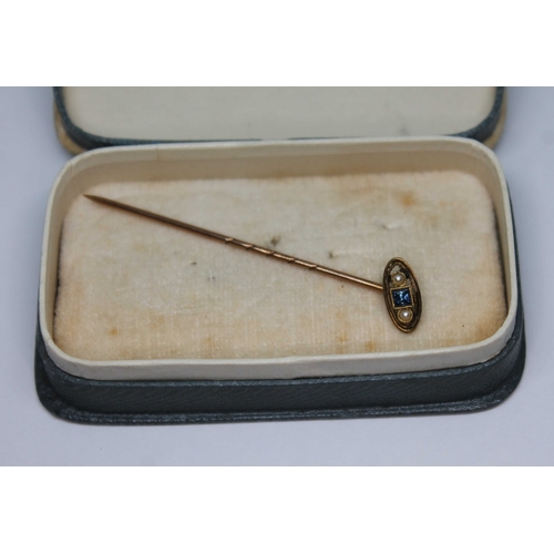 41 - A sapphire and split pearl stick pin, marked '9ct', gross wt. 1.02g.