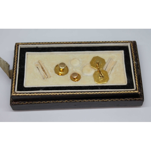 42 - A hallmarked 9ct gold single cufflink and two buttons marked '9ct', gross weight 3.54g.