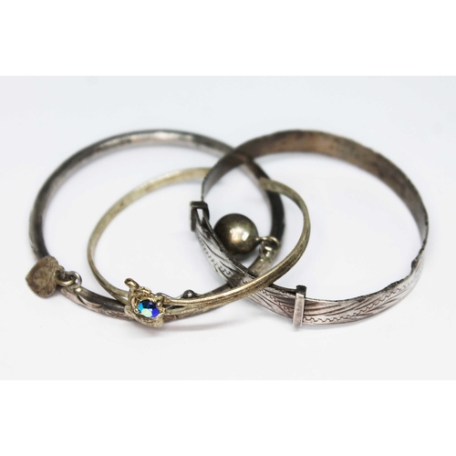 44 - Three christening bangles, one stamped silver, gross weight 15.15 grams.