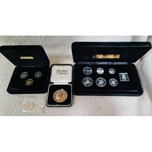 30 - A Pobjoy Mint Isle of Man silver proof coin set, a Pobjoy Mint Isle of Man proof £1 set plus one oth... 