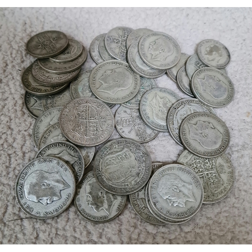 31 - A quantity of George V half crowns, florins and shillings.