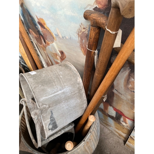20 - A galvanised watering can, a galvanised mop bucket and a selection of garden tools, spade, fork, she... 