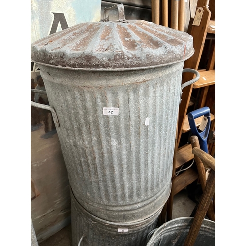 42 - A galvanised dust bin with lid.