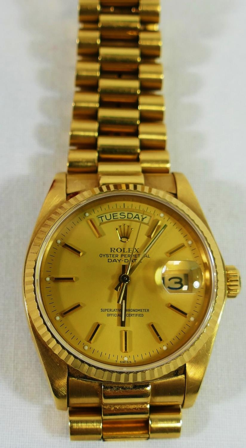 A 1980's 18 carat gold Rolex Oyster perpetual day date wrist watch, the