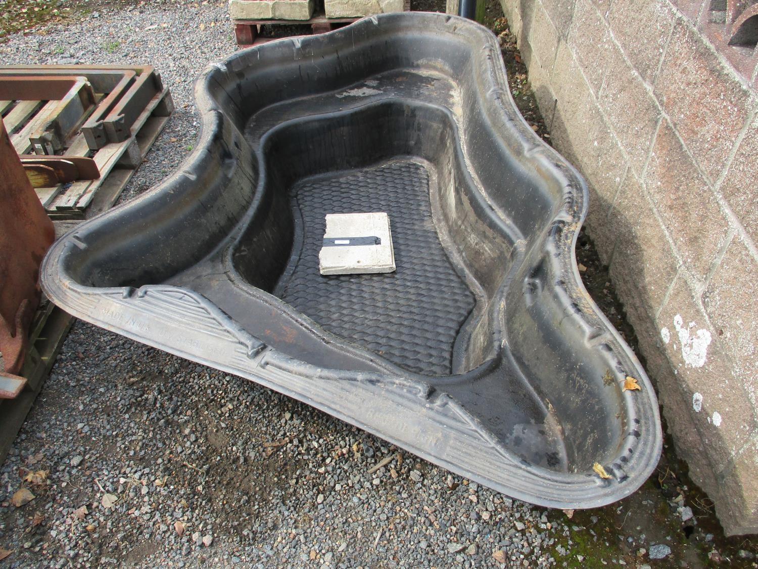 A plastic garden pond approximately 240cm wide