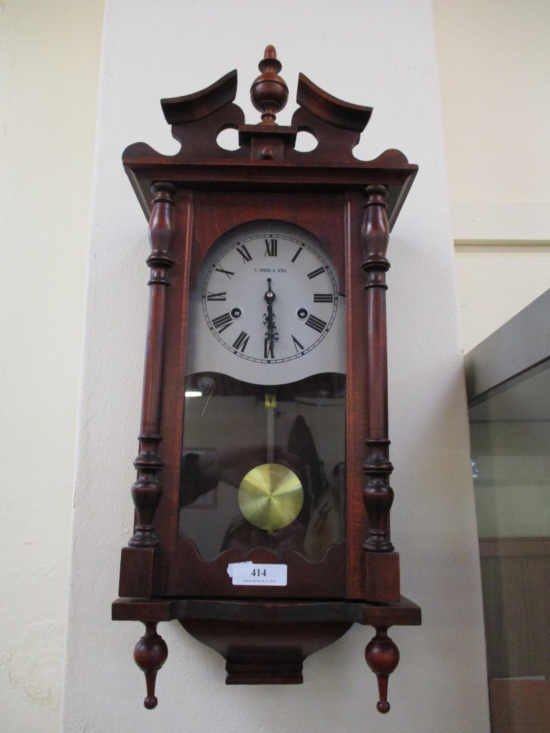 A mahogany cased wall clock by C. Wood & Sons