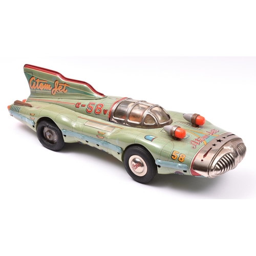 A rare late 1950's Japanese Yonezawa Tinplate Atom Jet Racer... | Barnebys