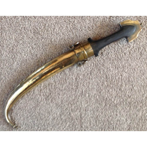 275 - An Early 20th C. Moroccan Koummya Dagger 
Hard wood handle brass fittings brass scabbard 
16 1/2