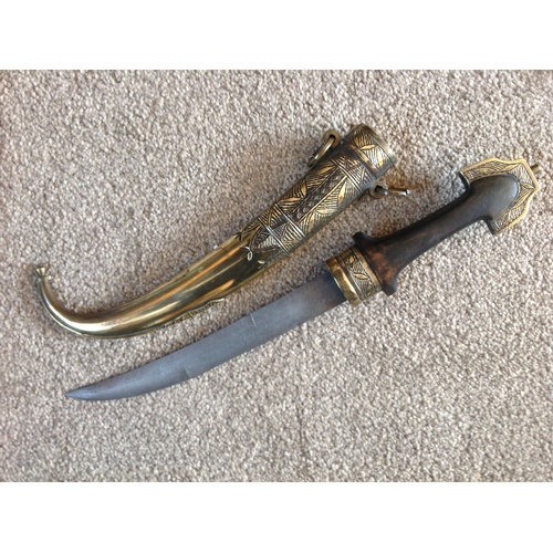 275 - An Early 20th C. Moroccan Koummya Dagger 
Hard wood handle brass fittings brass scabbard 
16 1/2