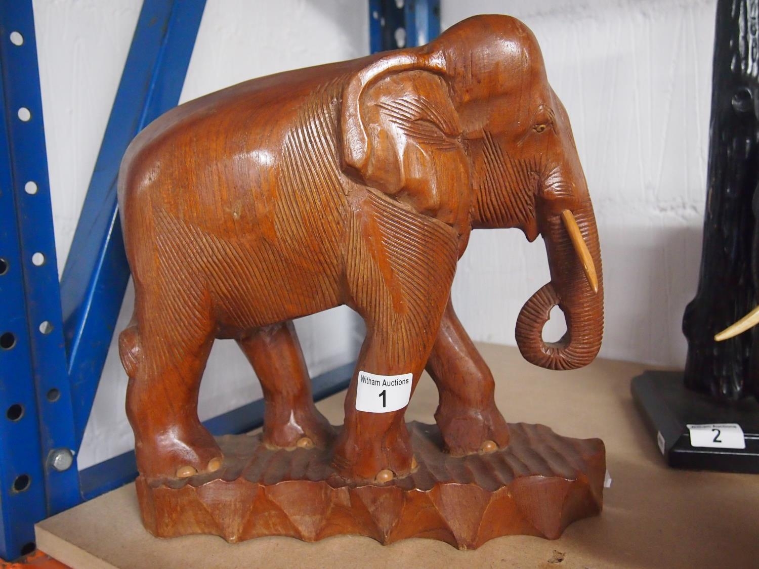 A large vintage hand carved wooden elephant, approx size 33x32cm