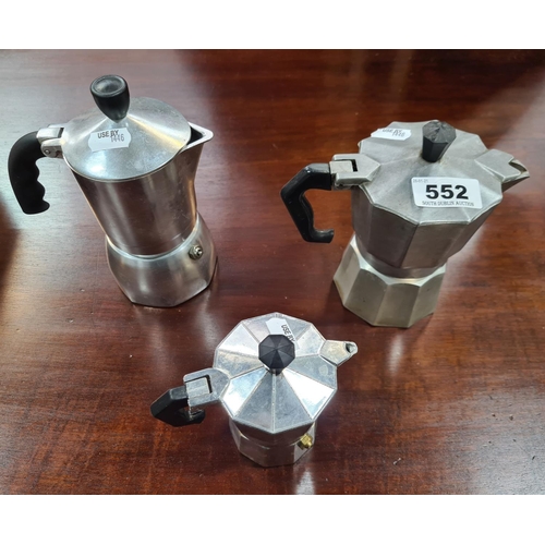 Three vintage coffee presses.