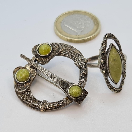 23 - Irish Silver Tara brooch and a similar marcasite and green stone ring.