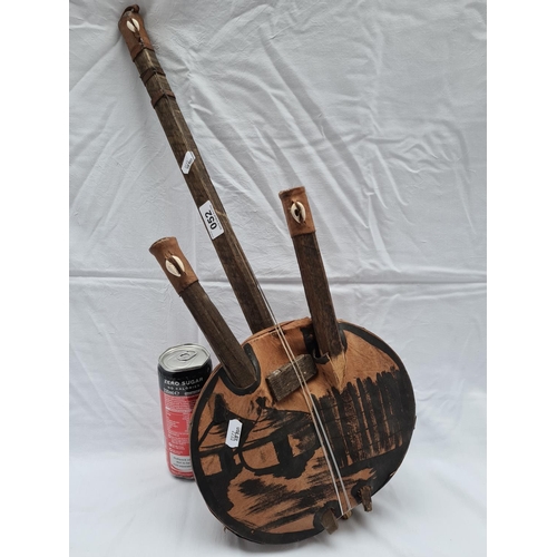 52 - Traditional African string instrument with cowrie shell decoration.