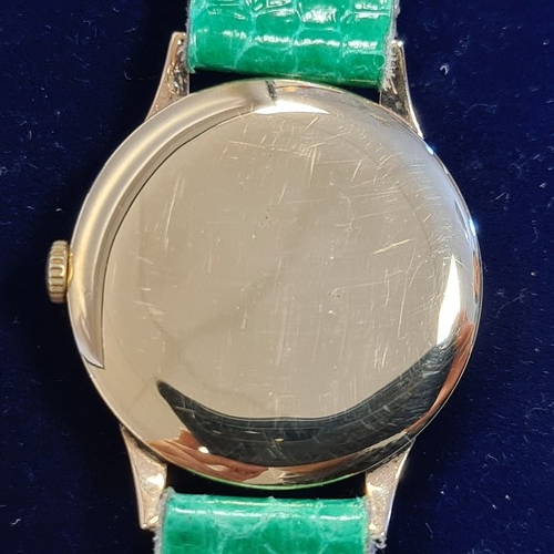 49 - 9ct case Gold Tudor Rolex. In good working order. With a later green reptile strap. Very good lot.