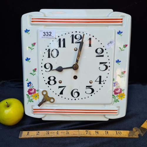 332 - Charming ceramic wall clock with key. Ticking away.