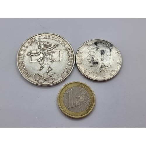 14 - Two silver coins, one a 25 Mexican peso celebrating the 1968 Olympics (weight 22.5g), together with ... 