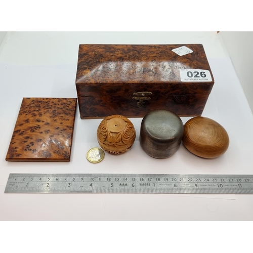 26 - A collection of five treen items, consisting of two screw top items and a further polished wood piec... 