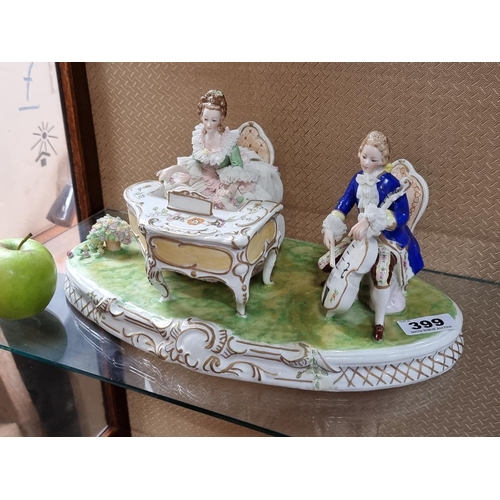 399 - Irish Dresden large recital piece. Hand painted porcelain sculpture of a couple playing musical inst... 