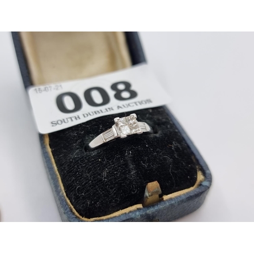 8 - A very attractive 18 carat white gold four stone diamond ring. Features diamond stone centre with di... 