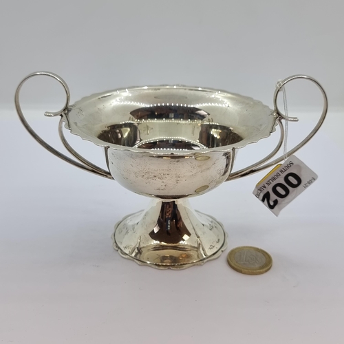 2 - A sterling silver large bonbon dish with piecrust rim and base and scroll handles. Maker's. Norton &... 