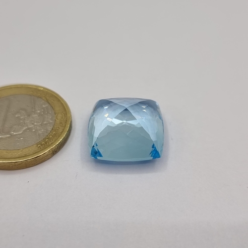 22 - A very nice example of a cushion cut natural topaz stone of 21.82 carats. A very bright and attracti... 