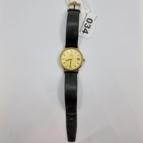 34 - Star Lot : A very clean example of an Omega 9K gold automatic Deville wristwatch with baton dial and... 