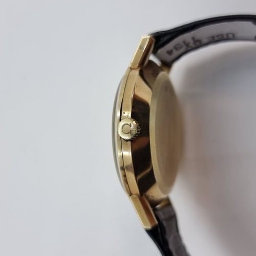 34 - Star Lot : A very clean example of an Omega 9K gold automatic Deville wristwatch with baton dial and... 