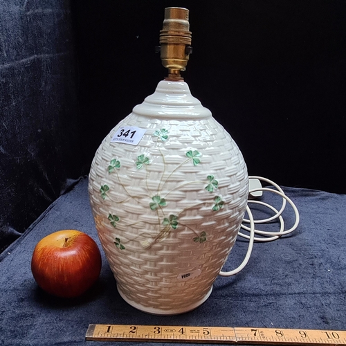 341 - A Belleek Table lamp in the basket weave and shamrock ''Kylemore'' pattern. In good condition - read... 