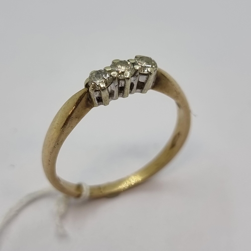 454 - Three stone diamond ring. Ring size P, weight 1.85g.