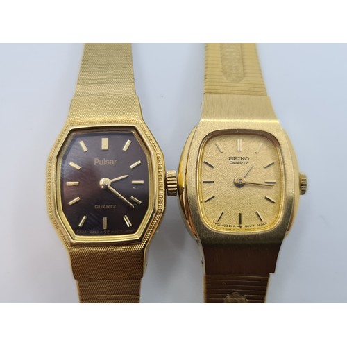 7 - Two new ladies watches consisting of a Seiko Quartz watch, with gold face and baton dial with associ... 