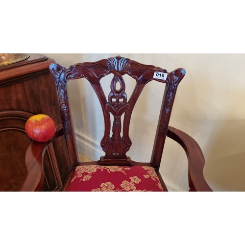 16 - A super ornately carved child's high chair with splat-back, claw-and-ball feet and red and gold dama... 