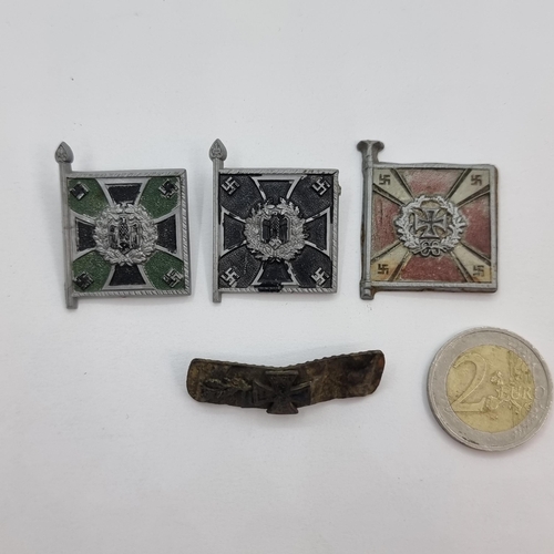 26 - A collection of four German WWII badges, one an authentic metal collar badge. Together with three fu... 