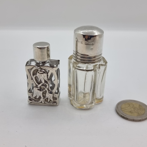41 - Two sterling silver dressing table items, one an interlaced perfume bottle with Birmingham hallmarks... 