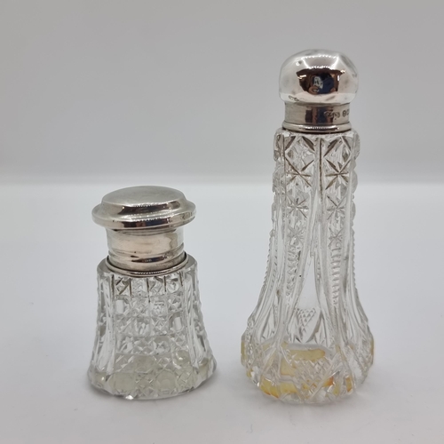 42 - A sterling silver topped hobnail cut perfume bottle with applicator. Hallmarked Birmingham, 1915. To... 