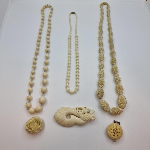 49 - A nice collection of Victorian ivory pieces consisting of three graduated necklaces, two pendants an... 
