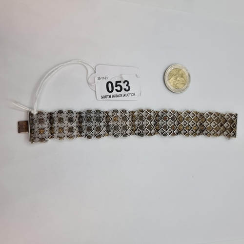 53 - An Art Deco designed sterling silver bracelet with diamond shape detail. Length of bracelet 19cm, we... 