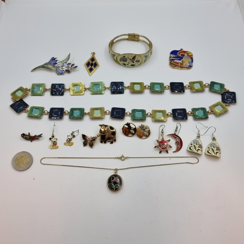 56 - A collection of good quality vintage enamelled jewellery. Consisting of two necklaces, a bangle, two... 