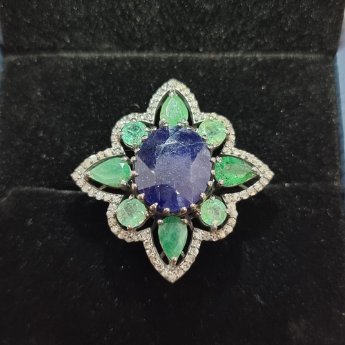 14 - Star Lot: A very pretty Sapphire, emerald and diamond ring, set in sterling silver. Weight of Sapphi... 